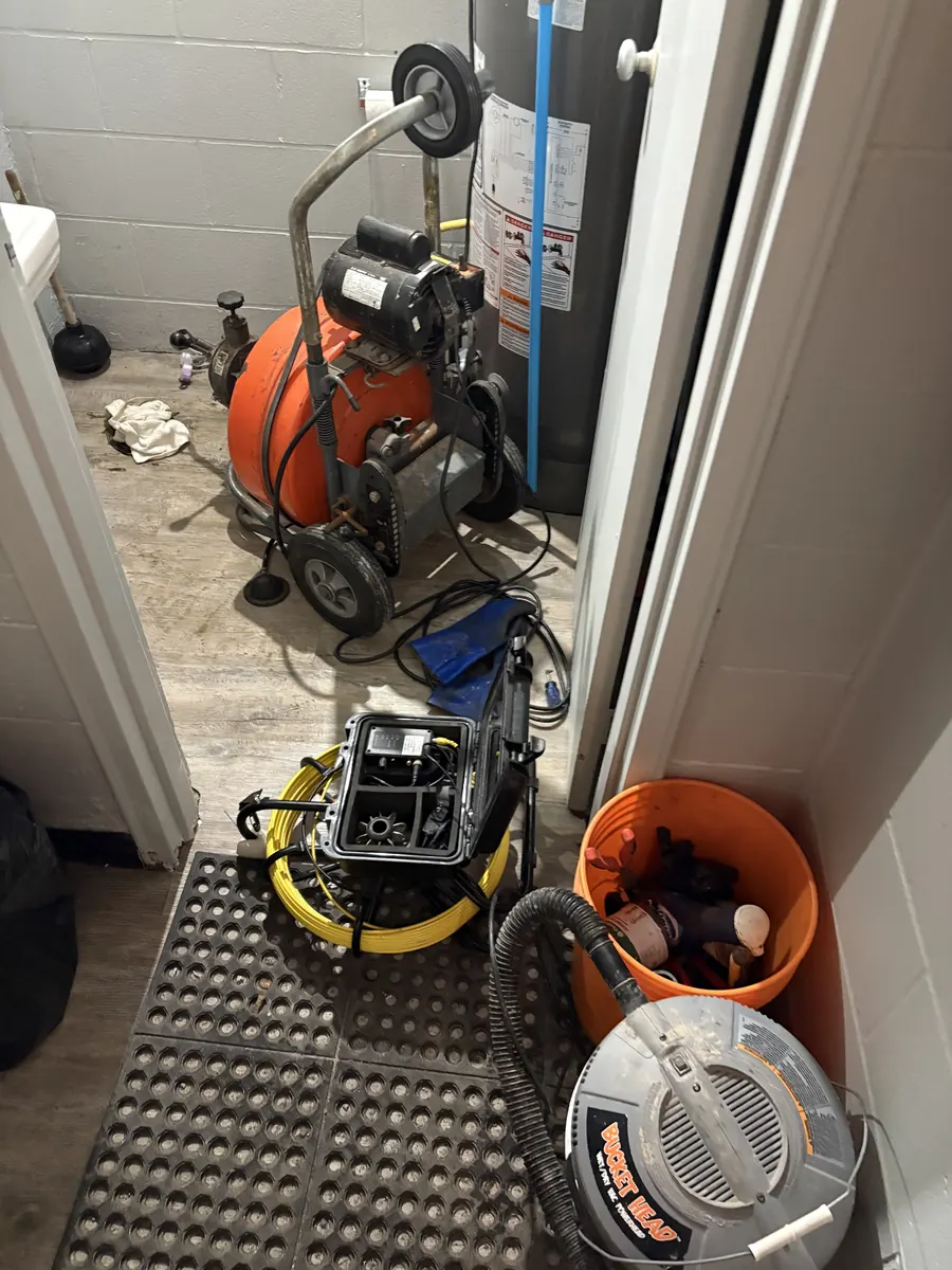 Drain cleaning machine and drain inspection camera staged in a utility room
