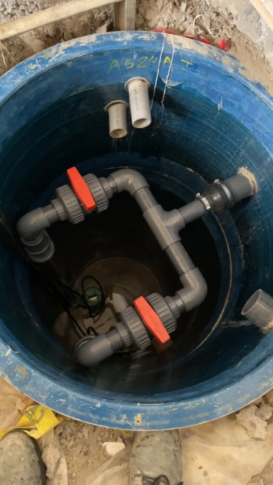 New pump pit with two pumps and PVC discharge piping